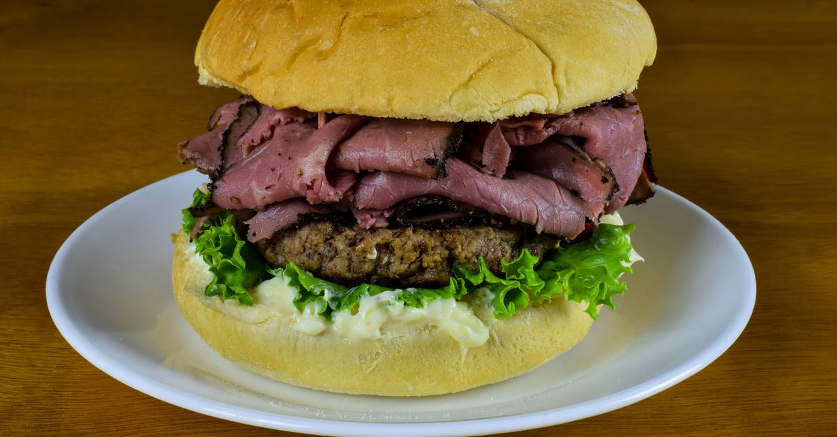 A burger made from pastrami - Burger on White Ceramic Plate