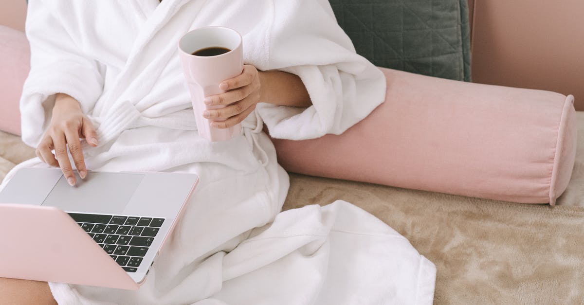 A cup of cilantro? - Woman in White Robe Holding White Ceramic Mug