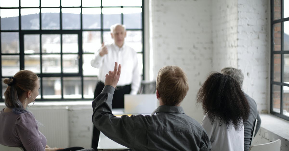 A stock question for British catering professionals - People Having a Discussion in a White Room