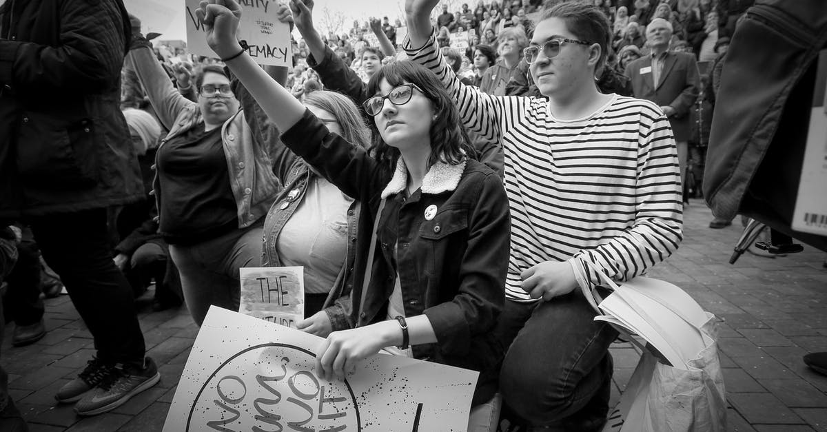 A thinner béarnaise? - Grayscale Photo of People Holding Banner