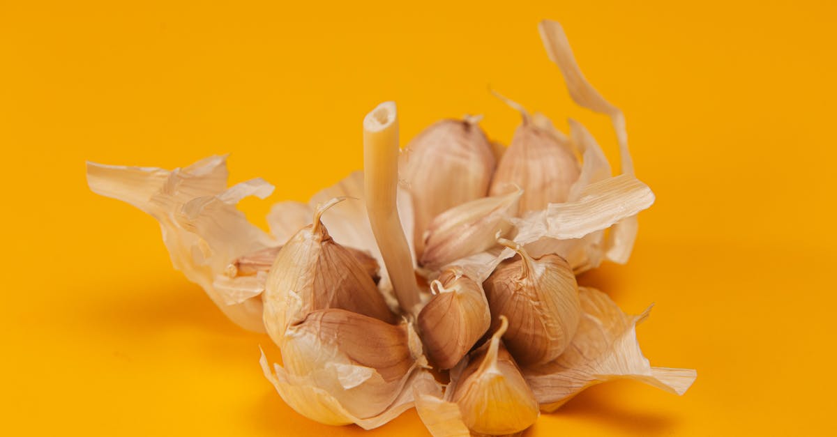 Accentuating Garlic flavour - White Garlic on Yellow Surface