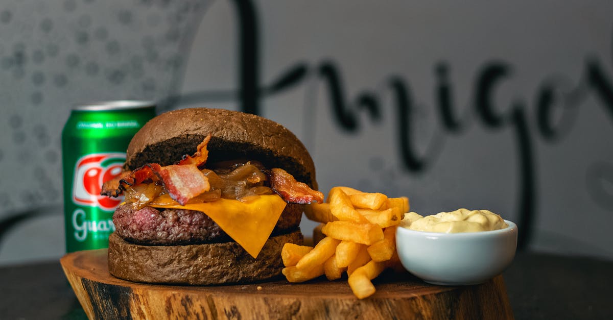 Accidentally refrigerated Mayonnaise - Burger With Fries on Brown Wooden Chopping Board