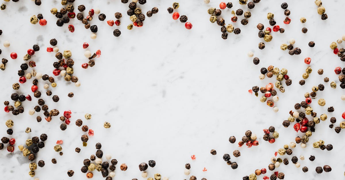 Achieve butter-like aroma in a vegan recipe - Assorted pepper spilled on white table