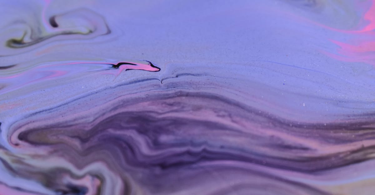 Achieving 'glossy', ultra smooth pudding texture - Full frame abstract background of diffusing purple ink blending and flowing together on uneven surface