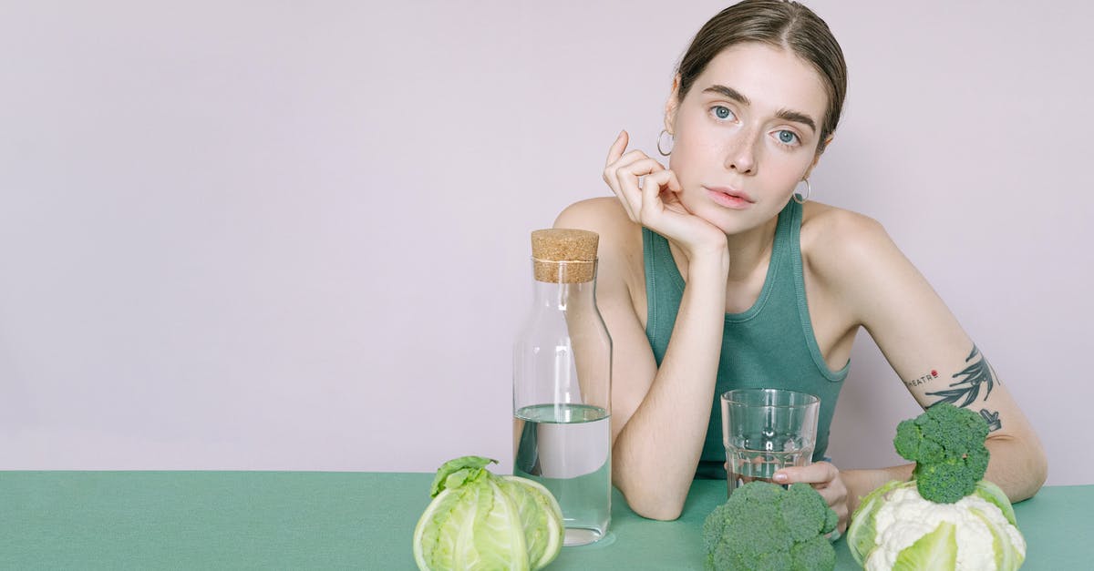 Acidity level not increasing when fermenting cauliflower - Woman in Green Tank Top Sitting on Green Table