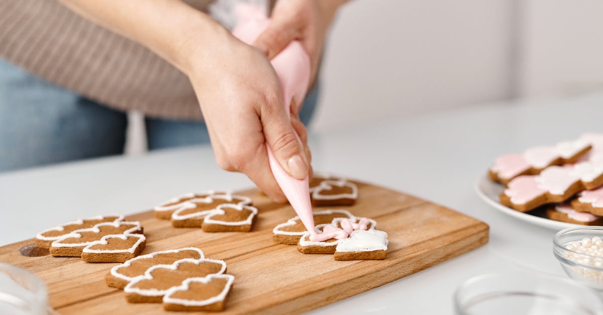 Adding cold water during cooking of beans and cooking time - Person Decorating a Christmas Tree Shaped Cookies