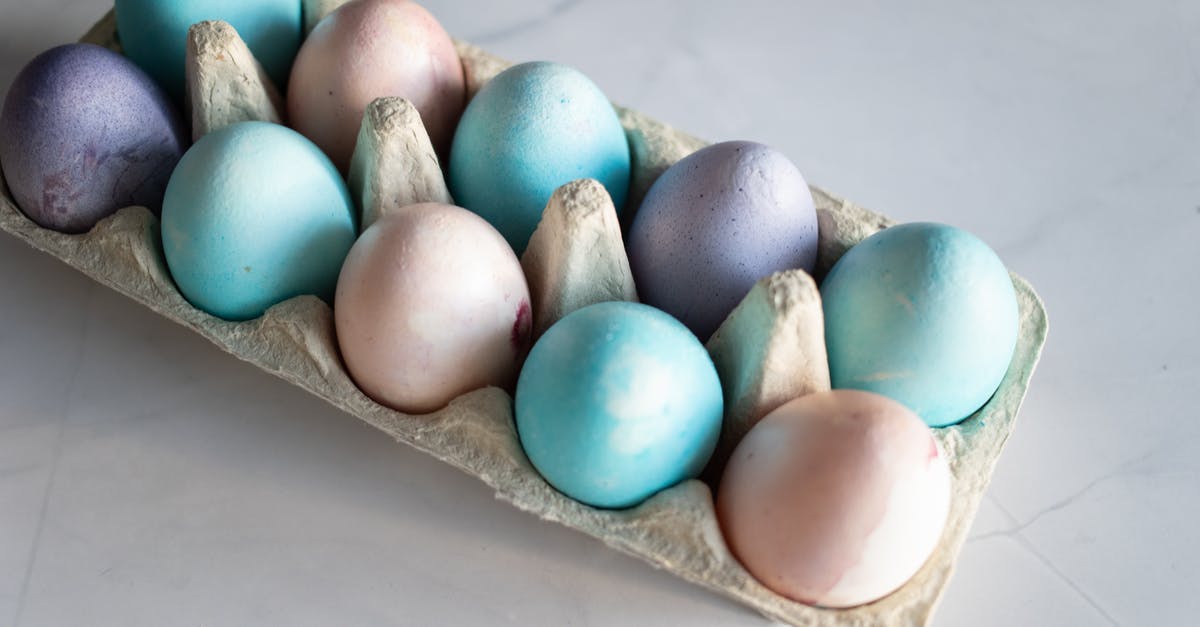 Adding eggs to lasagna - Blue Egg on Brown Egg Tray