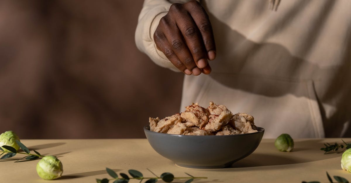 Adding salt to a marinade to brine? - Person Holding White Ceramic Bowl With Brown Food