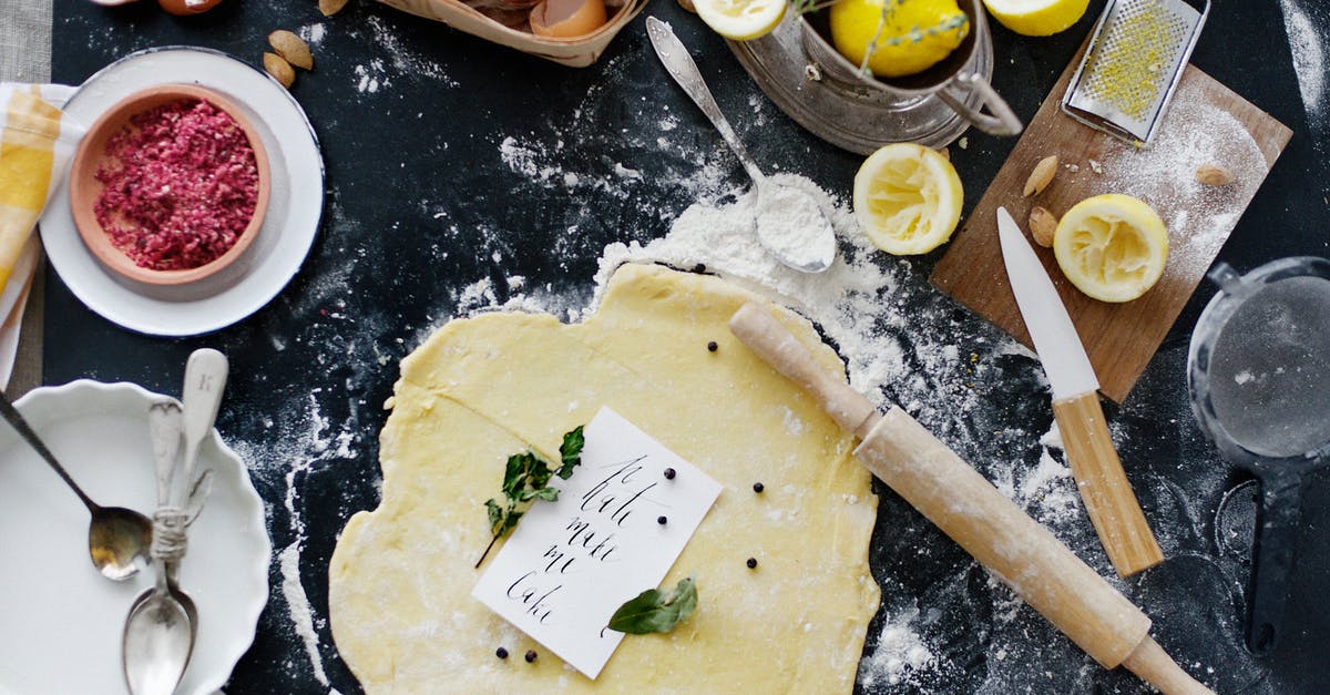 Adding too much flour to bread dough in Kitchenaid Stand Mixer? - Dough and Flour Near Lemons and Rolling Pin