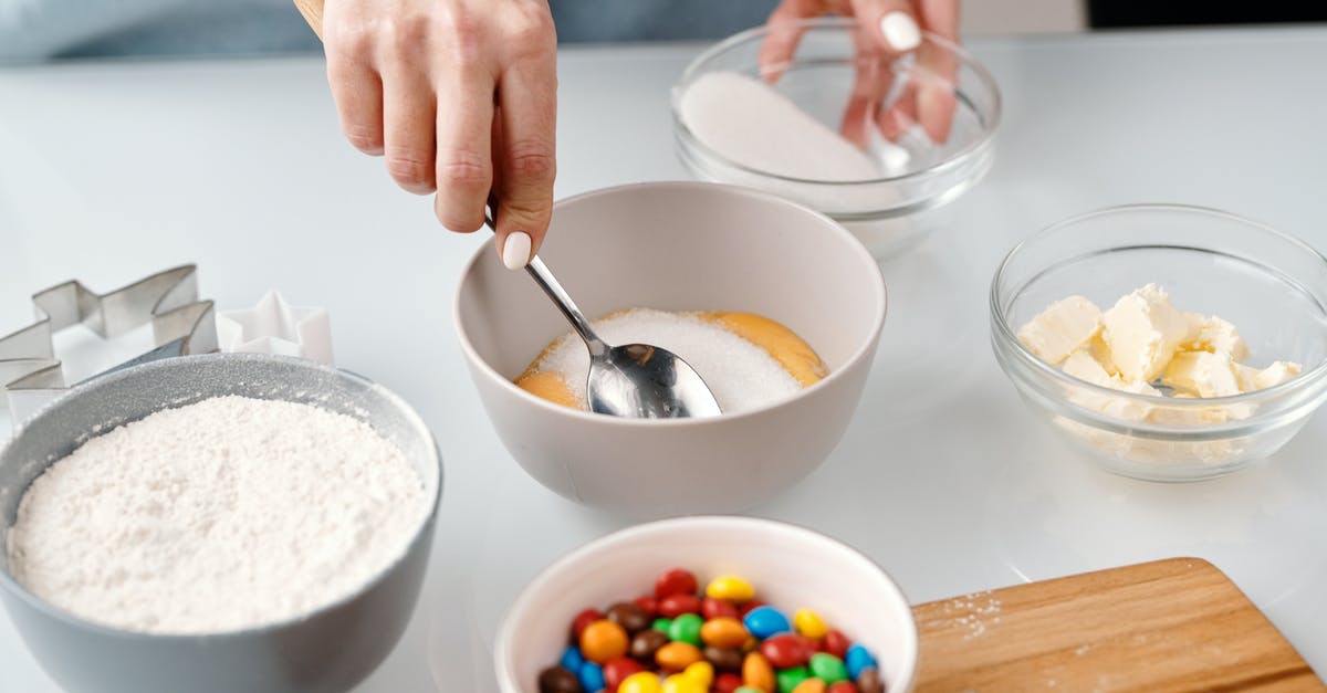 Adding xanthin gum to regular flour containing gluten - Person Mixing Yellow Eggs in a Bowl