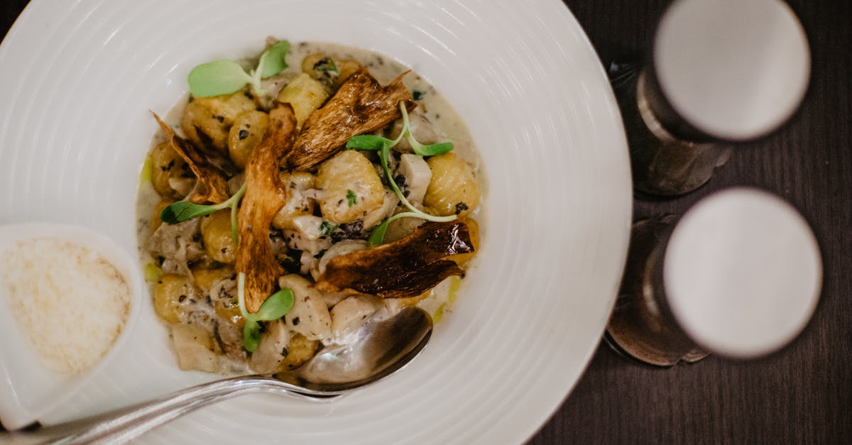 Adjust salt (in mushrooms) - Potatoes and mushrooms with chicken in white plate