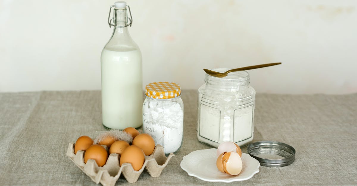 Adjusting baking powder to work with almond milk - Baking Ingredients in Containers on a Table