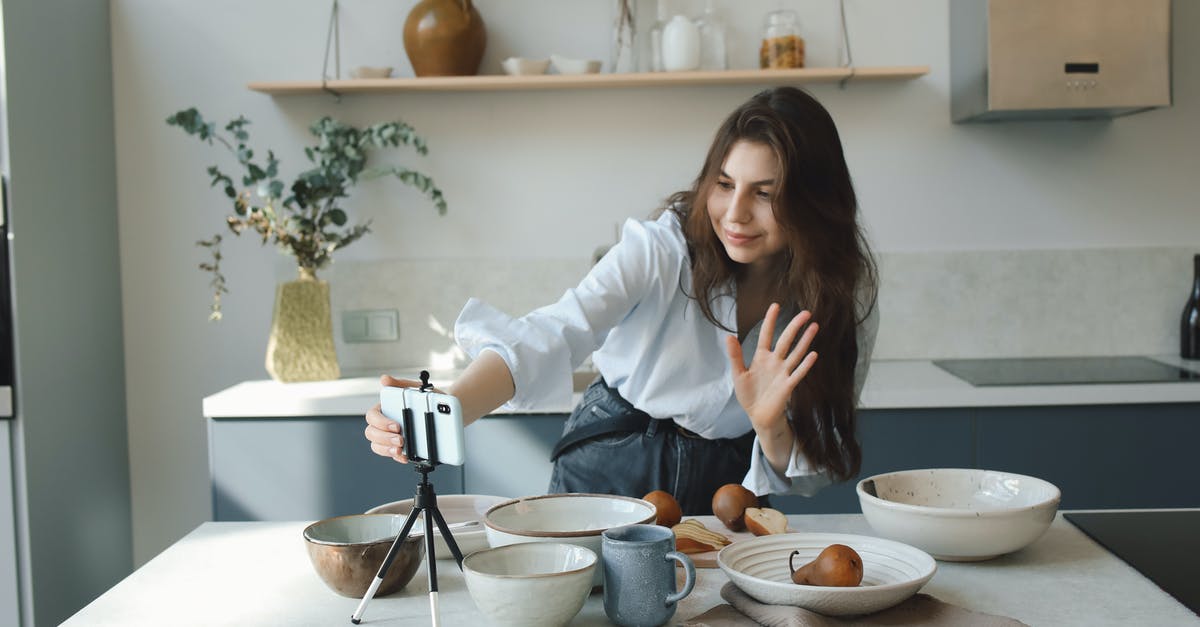 Adjusting Cooking For Smaller Portions - Woman in White Long Sleeve Shirt Sitting on Chair