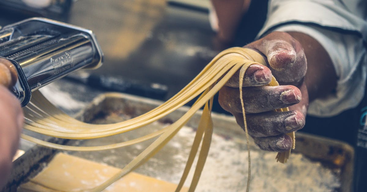 Adjusting cooking time and temperature when making smaller portions - Person Making Pasta Tagliatelle