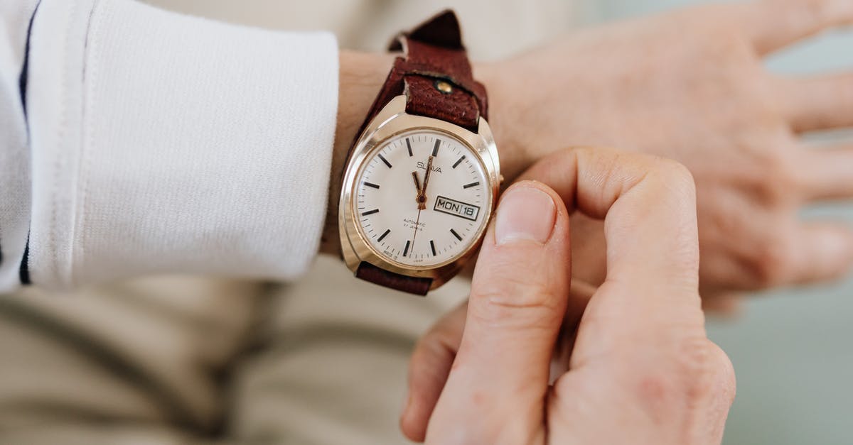 Adjusting cooking time and temperature when making smaller portions - Person Wearing a Wristwatch