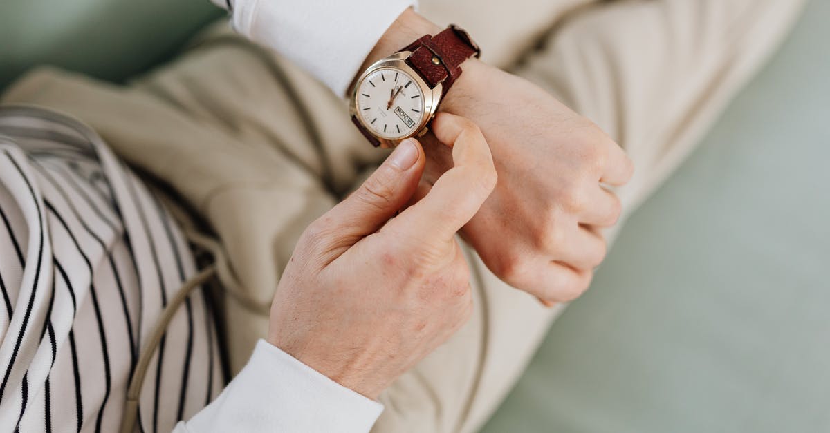 Adjusting Microwave Times - Person Wearing an Analog Wrist Watch