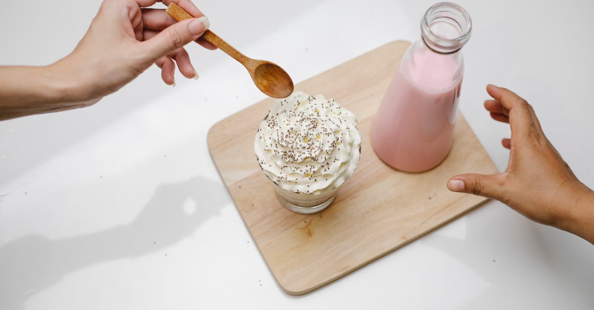 Adjusting whipped cream to hold its shape longer? - People taking dessert and glass bottle of milkshake placed on wooden board