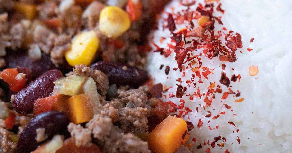 Advice for Rice balls in bulk - Closeup of tasty main course with ball of rice near chopped vegetables mixed with ground meat