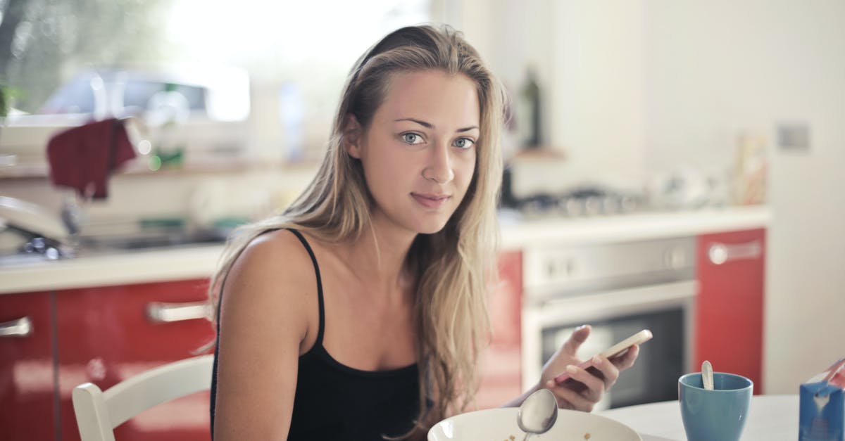 After how long is boiled milk tea consumable? - Woman in Black Tank Top Eating Oatmeal