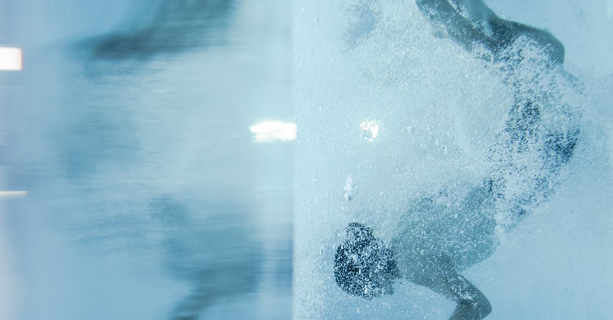 Air bubbles in sausage - Person Diving Under Water