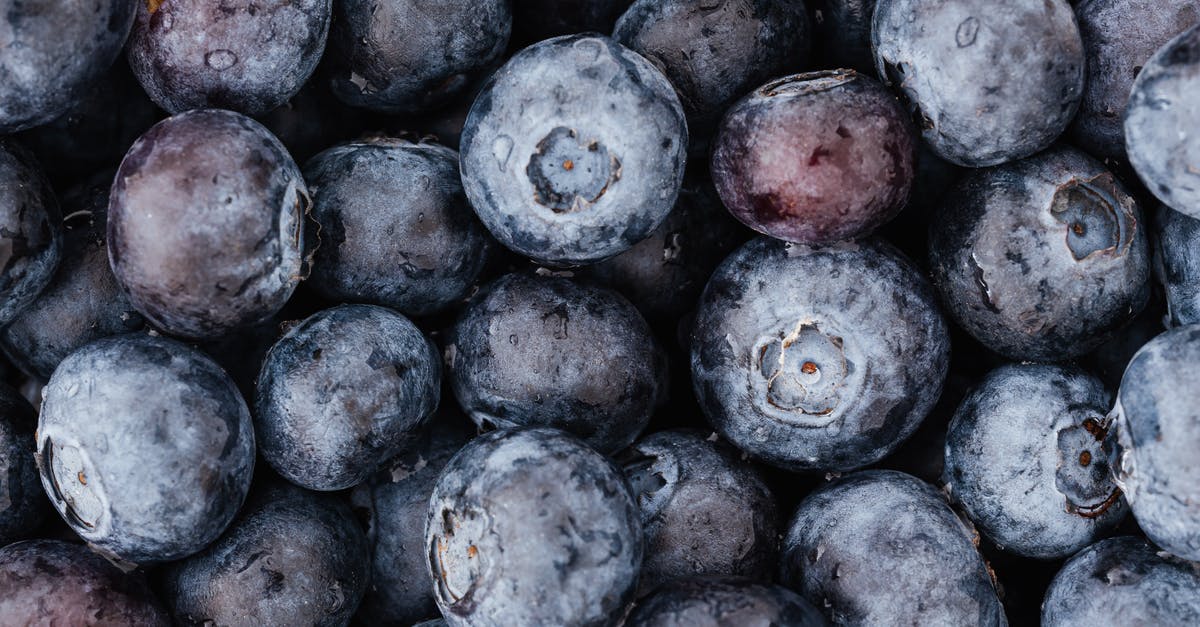 Air-fried sweet potatoes come up dry and tough? - Top view closeup of colorful ripe blueberries arranged in full frame heap