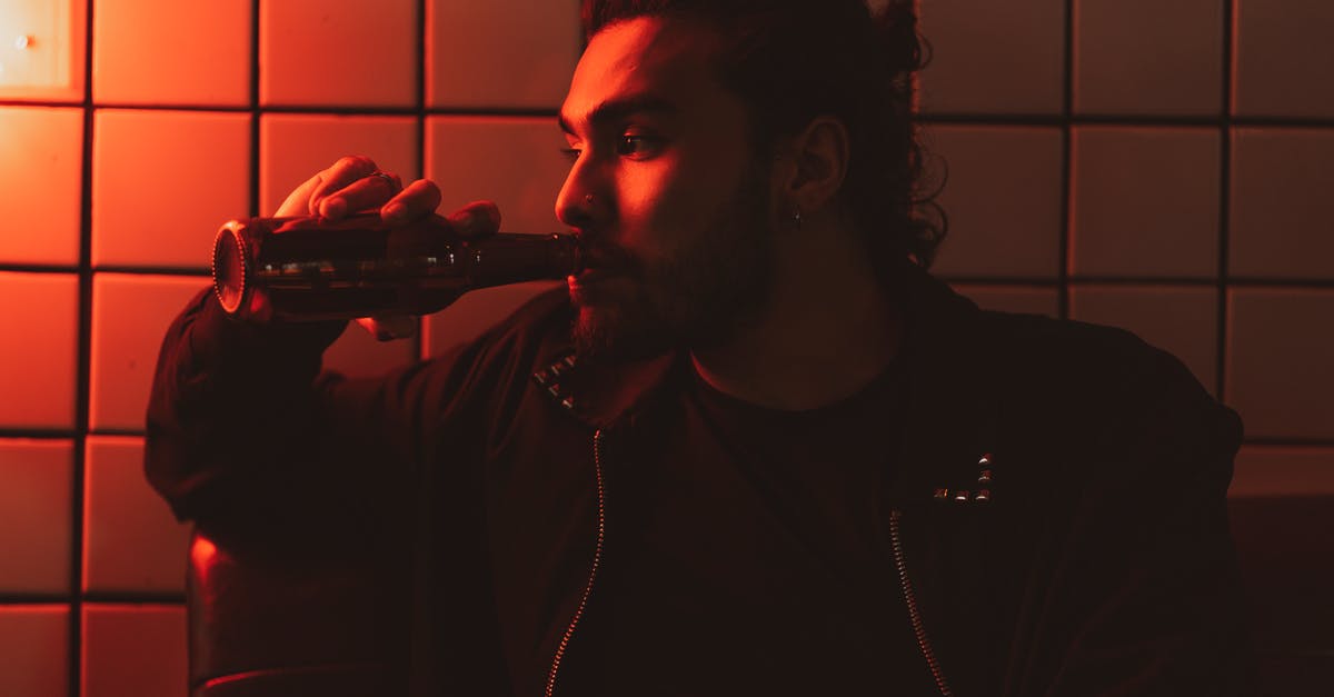 Alcohol evaporation of beer in a cake - Man in Black Shirt Smoking Cigarette