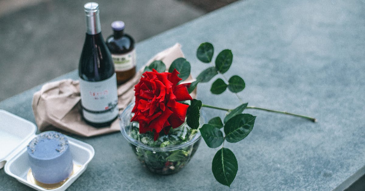 Alcohol-optional desserts? - Composition of red rose placed on parapet near champagne bottle