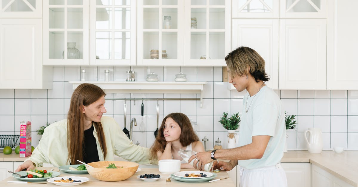 Alkaline foods with a pH higher than 8 - Man and Woman Sitting at Table Eating