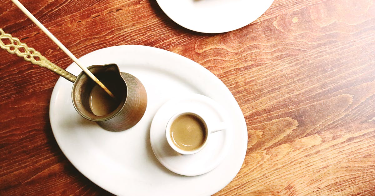 All Clad Copper Core - everything sticks, why? - Top view of ceramic plate with copper cezve and cup of tasty coffee near yummy dessert on wooden table in apartment