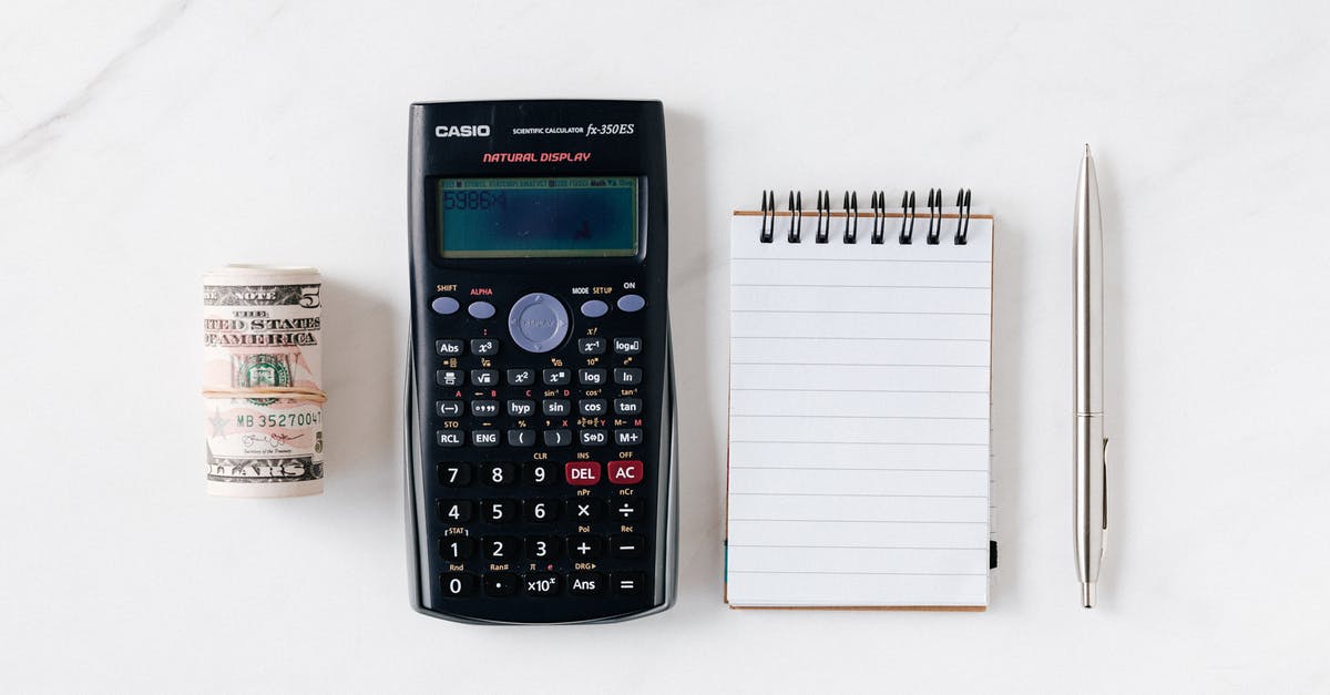 American "Bacon Roll" - what is it? - Composition of calculator with paper money and notebook with pen