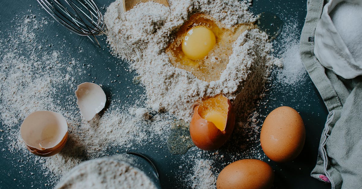 Amount of salt in bread - Flour and eggs scattered on table before bread baking