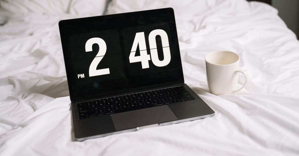 Amount of time boiling gnocchi - Black and Silver Laptop Computer Beside White Ceramic Mug on White Textile