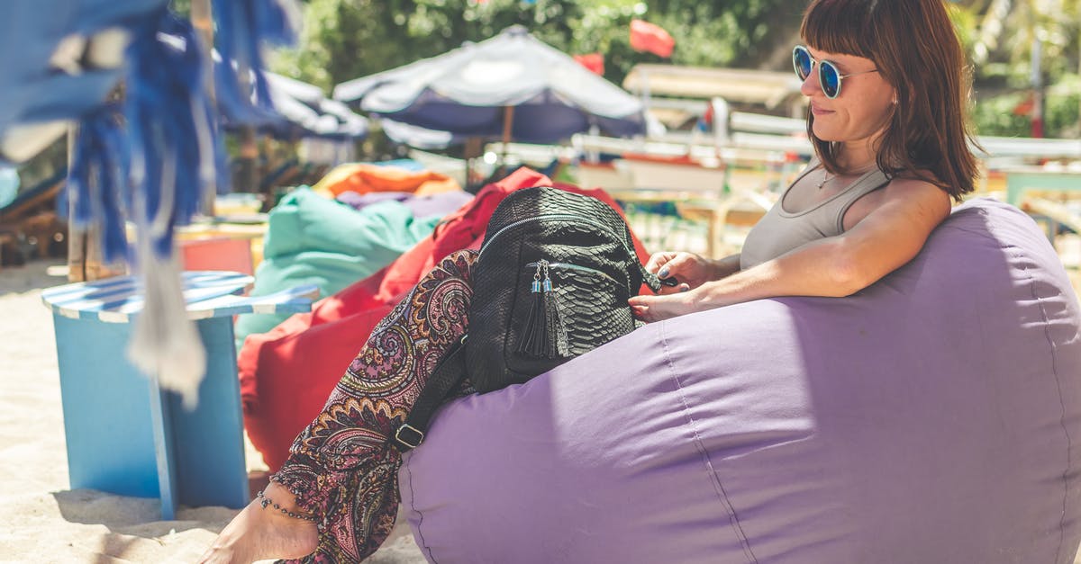 Animal Stock from Vegetable Stock - Woman Wearing Gray Tank Top Sitting on Purple Bean Bag