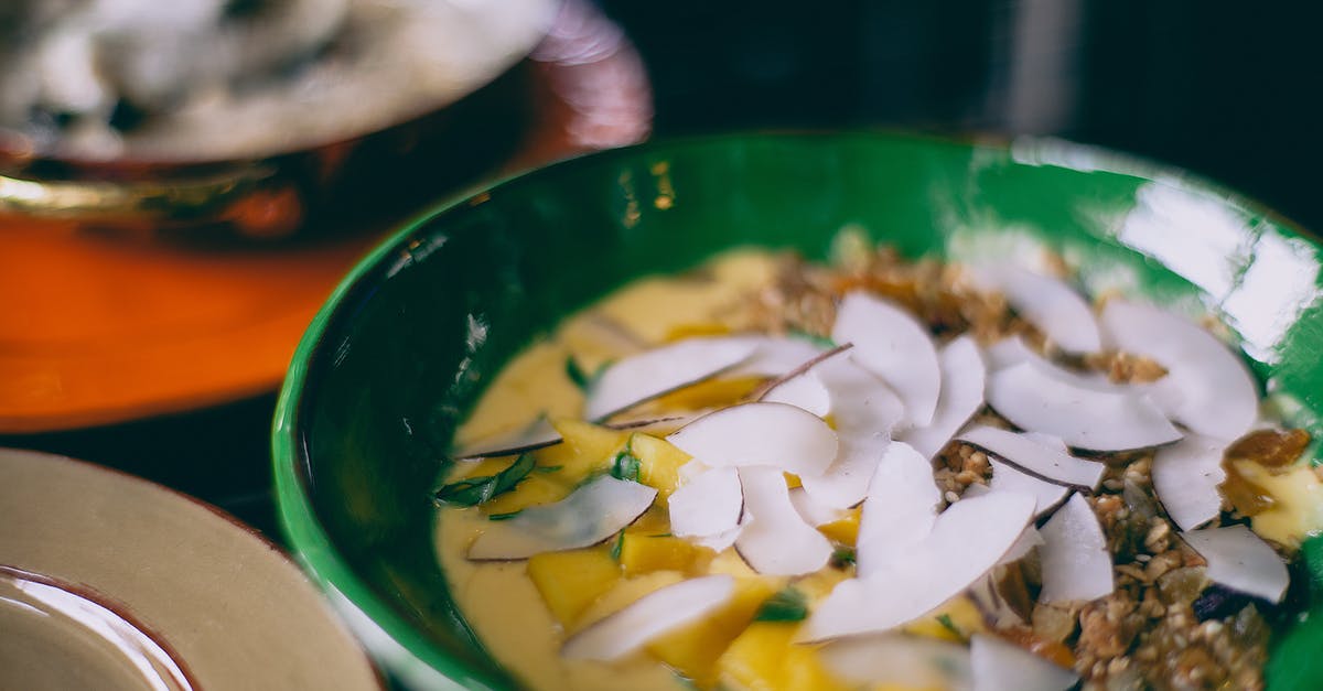 Any way to reduce the tangy taste of homemade coconut milk? - Delicious dish served with topping