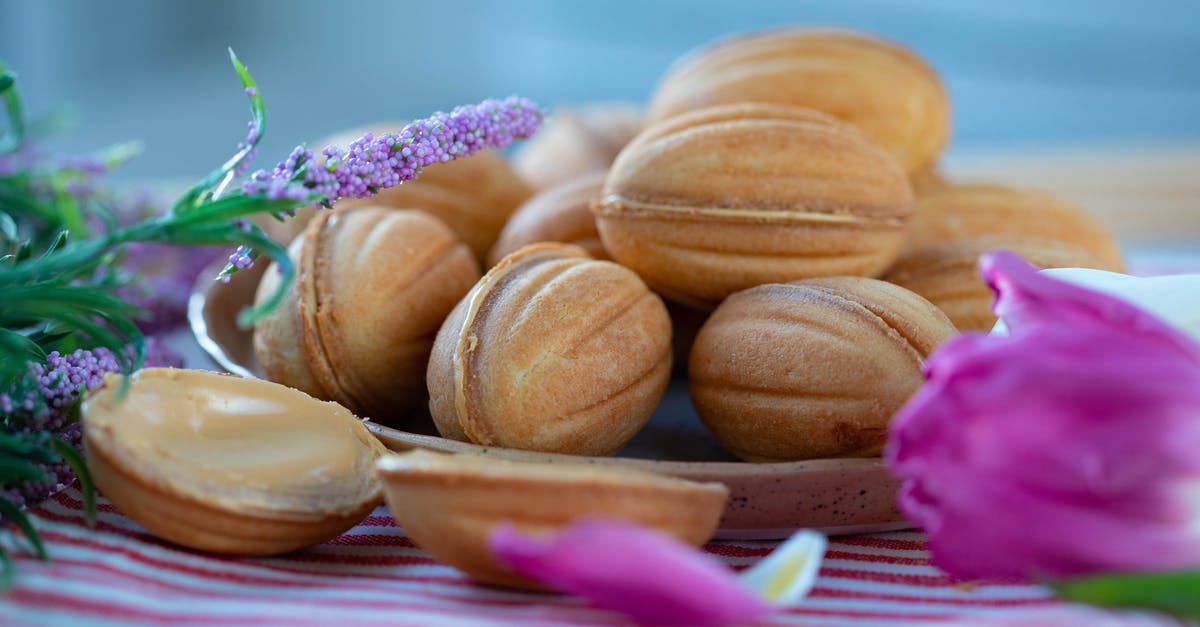 Any way to reduce the tangy taste of homemade coconut milk? - Tasty walnut shaped cookies placed on plate in room