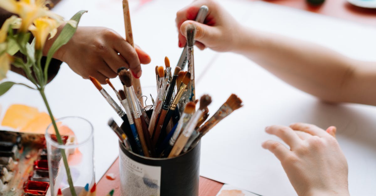 Anybody know where I can get some Stanley spatulas? - Person Holding Paint Brush on Paint Brush