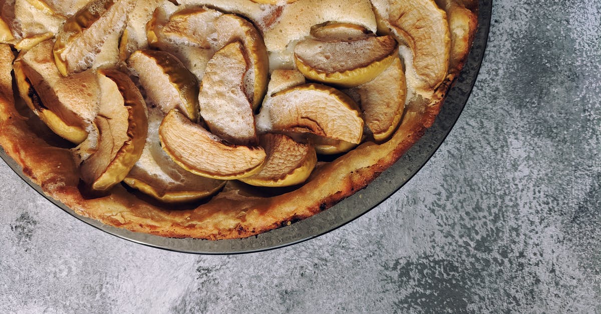 Apple Pie Failure - Top view of delicious fresh apple pie placed on plate on rough gray table