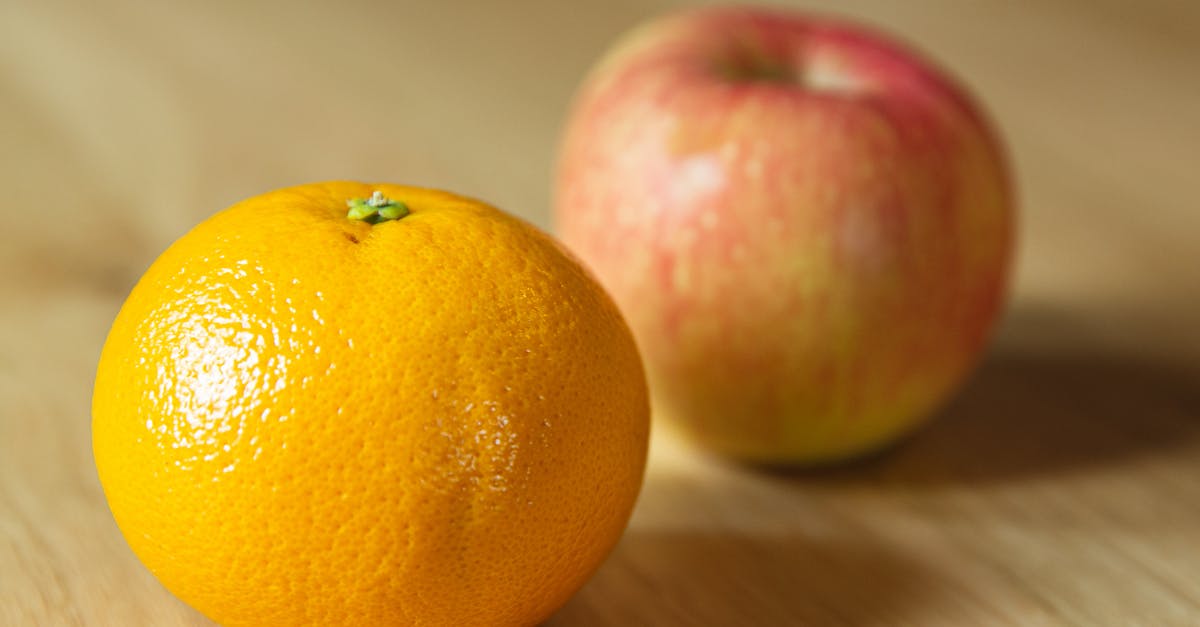 Apple pie: peel or not? - Ripe fresh tangerine with apple on table