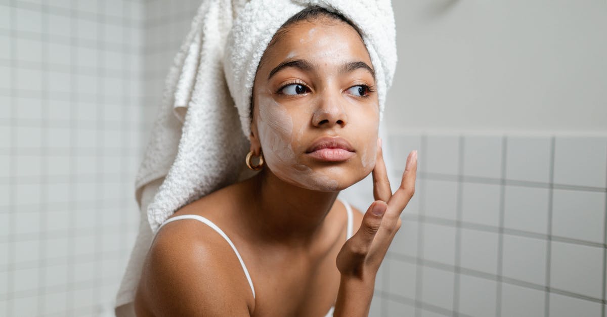 Applying a binder to chicken after wet marinating - Woman Applying Face Cream