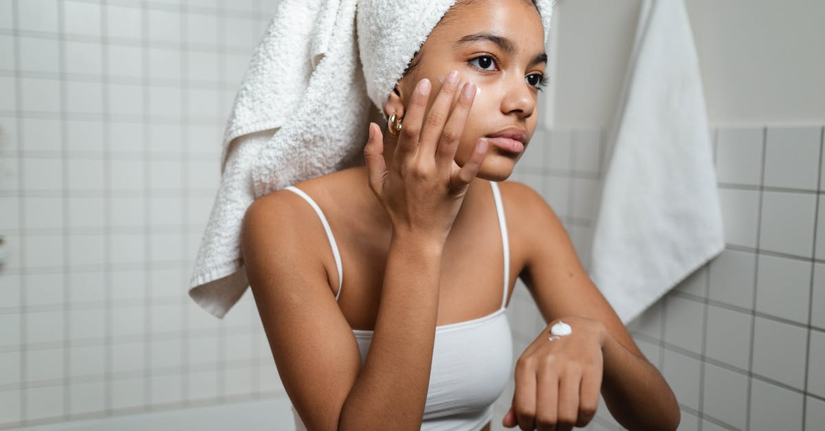 Applying a binder to chicken after wet marinating - Woman Applying Face Cream 