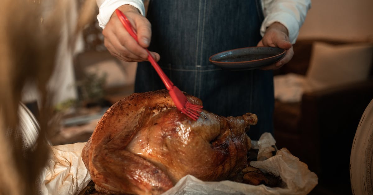 Applying a binder to chicken after wet marinating - Hand Brushing Roasted Chicken 