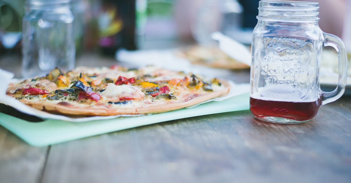 Appropriate oil to infuse with hot chillies - Pizza on Green Chopping Board Near Two Clear Glass Mugs