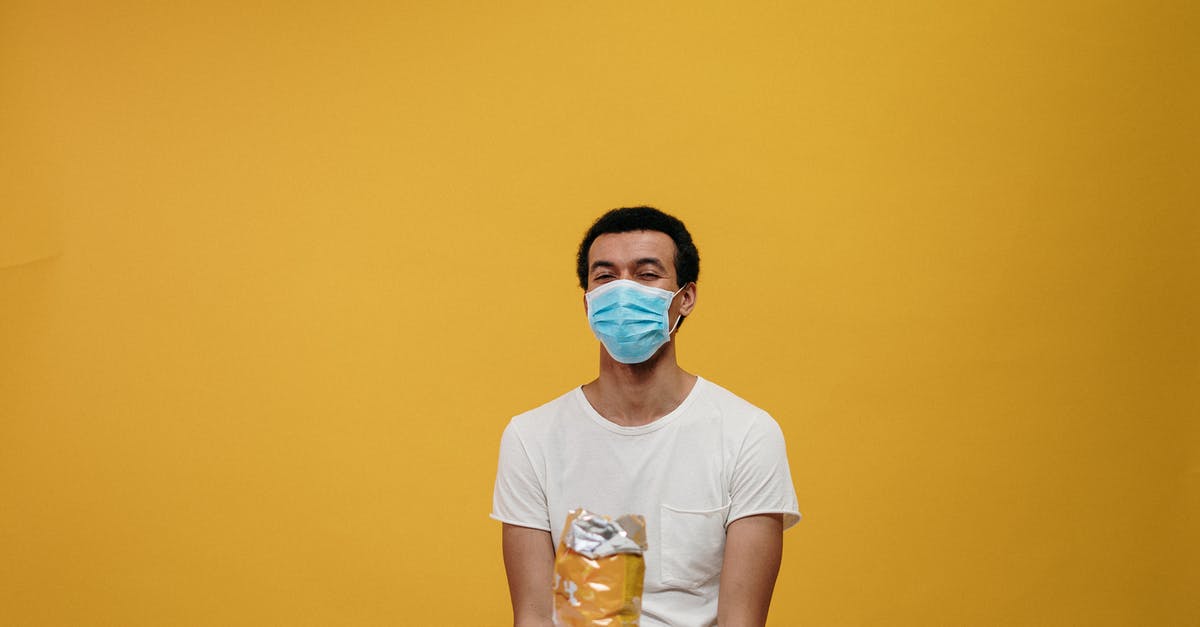 Are accidentally fermented foods safe to eat - Man in White Crew Neck T-shirt Sitting by the Table