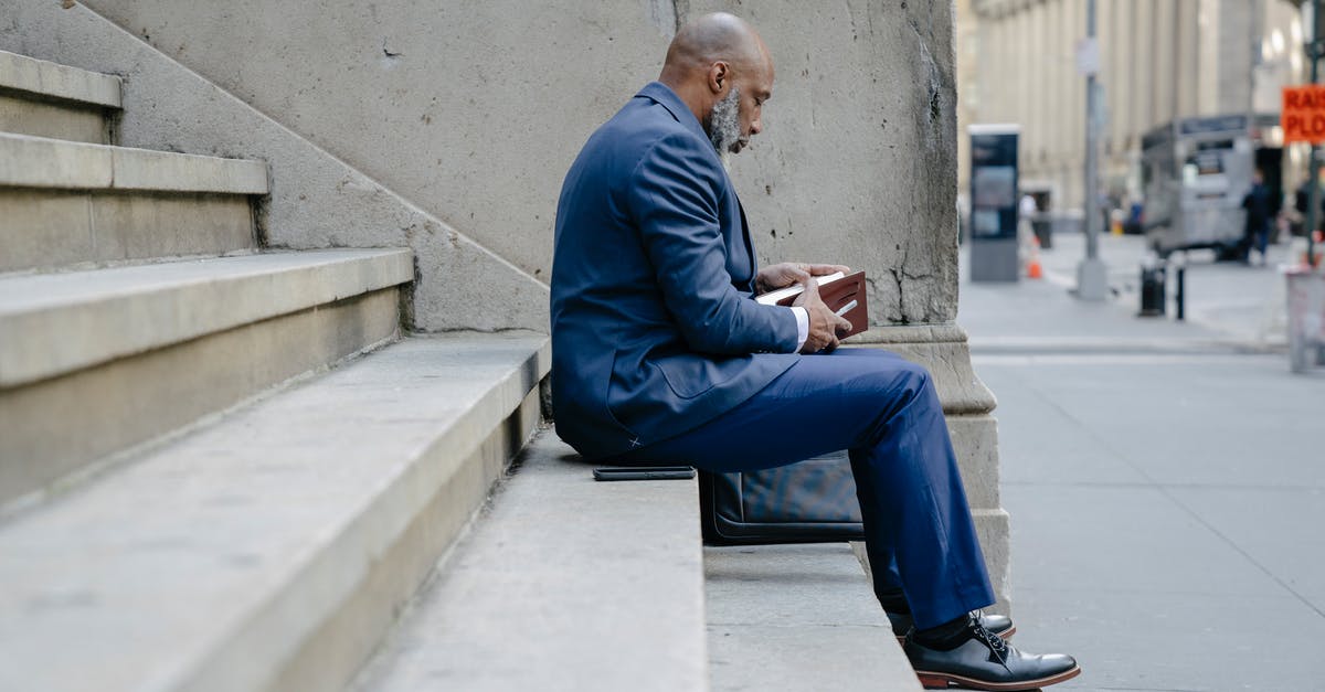 Are all the processing steps of tofu harmless? - Man in Blue Suit Jacket and Blue Pants Sitting on Concrete Bench