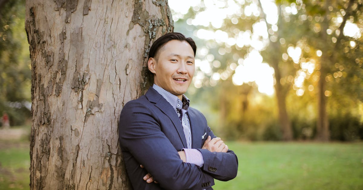 Are any kind of wood-chips good enough for smoking? - Photo of Man Leaning On Tree