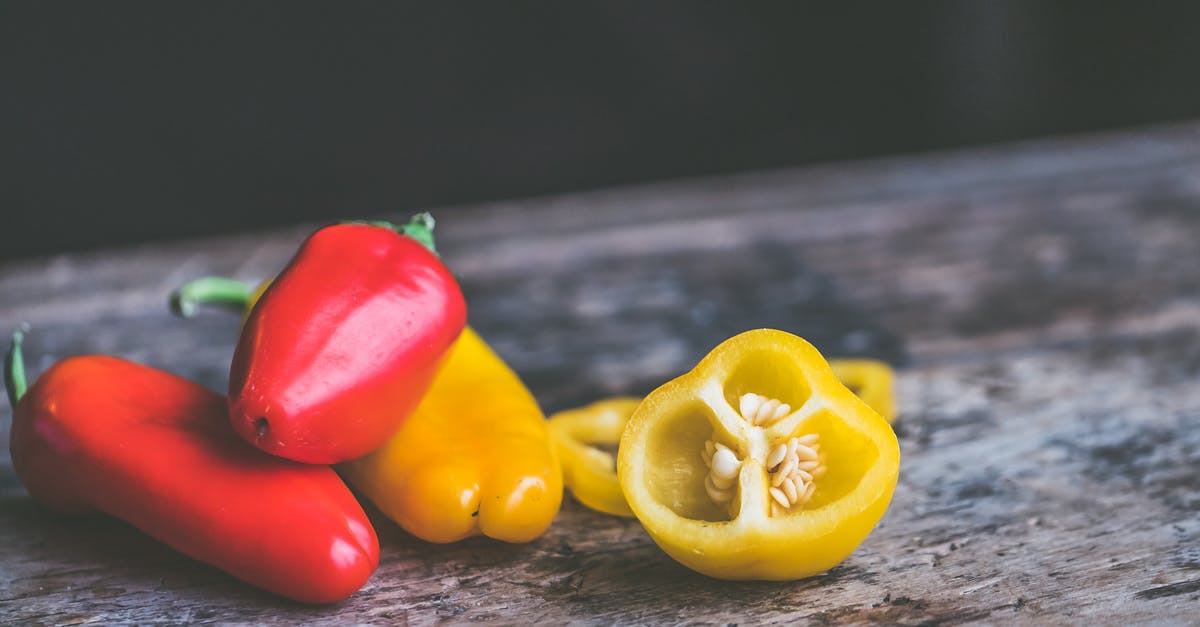 Are bell peppers with brown seeds safe to eat? - Bell Peppers on Gray Table