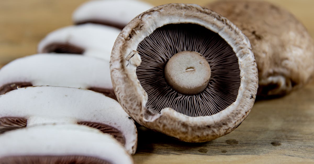 Are cremini mushrooms and chestnut mushrooms the same thing? - White and Brown Mushrooms on Brown Wooden Table