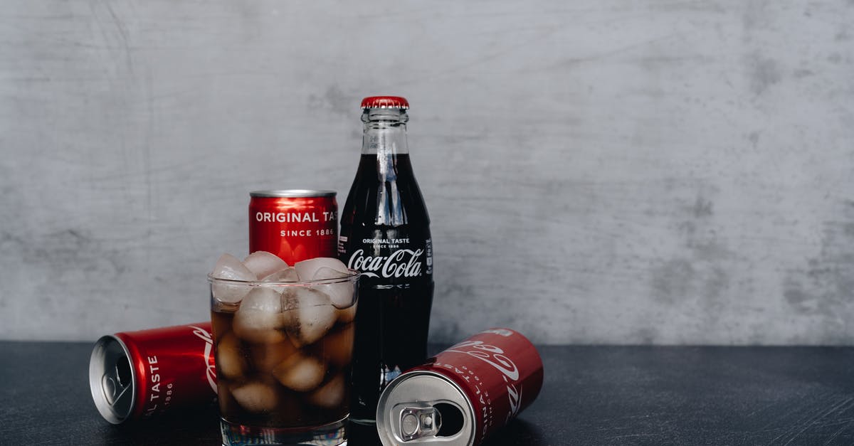 Are ice tea in bottles considered as carbonated drinks like coke? - Close-Up Photo Of Glass With Ice