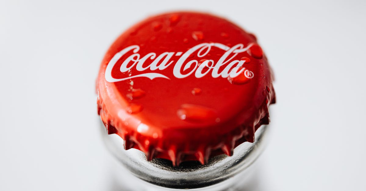 Are lebkuchenherzen made from the same mixture as Lebkuchen? - Closeup of red metal bottle cap placed on glass bottle with water droplets on white background