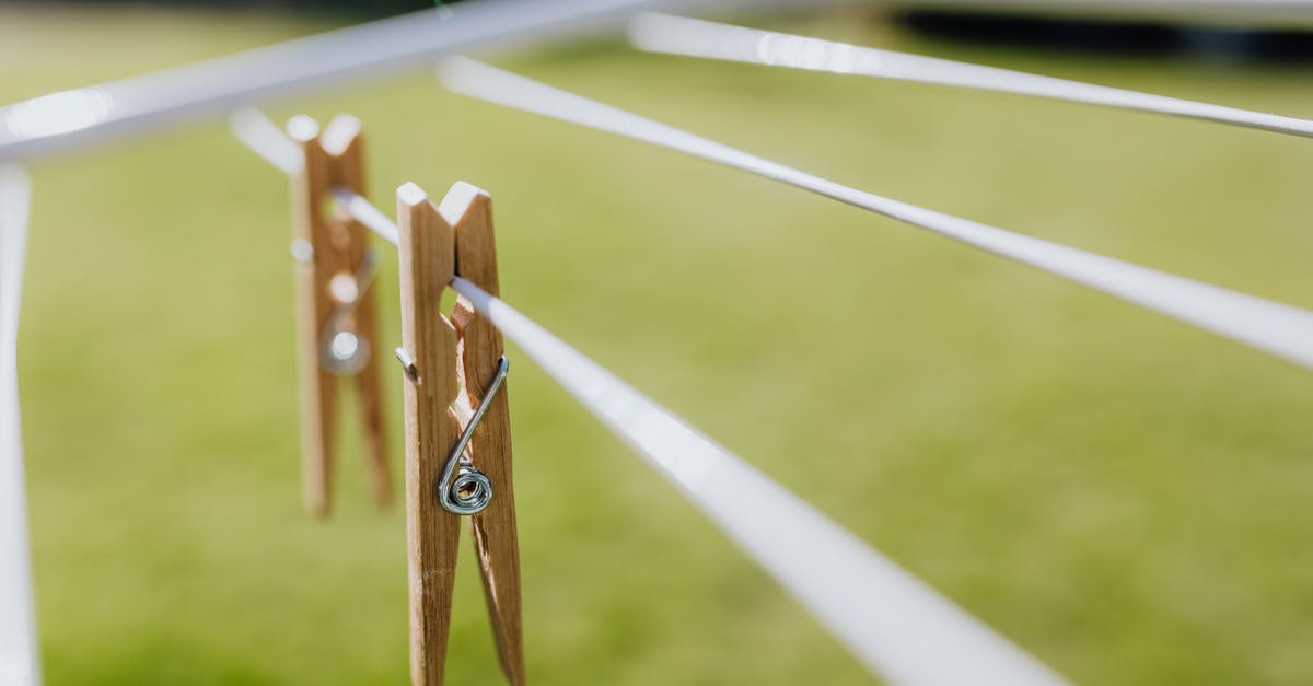 Are MSG and Accent (Seasoning) the same thing? - Composition of wooden clothespins hanging on collapsible clotheshorse placed on green lawn in garden on sunny day